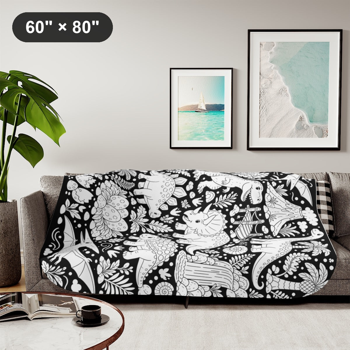 Dinosaur Jungle Sherpa Blanket kit shown in a lifestyle mockup - styled in a living room - 60" × 80"