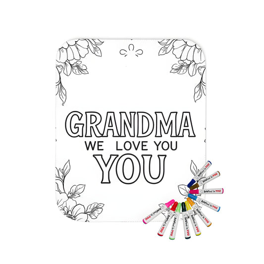 Cozy blanket with grandma-themed coloring page design, featuring floral border and 'GRANDMA WE LOVE YOU' text