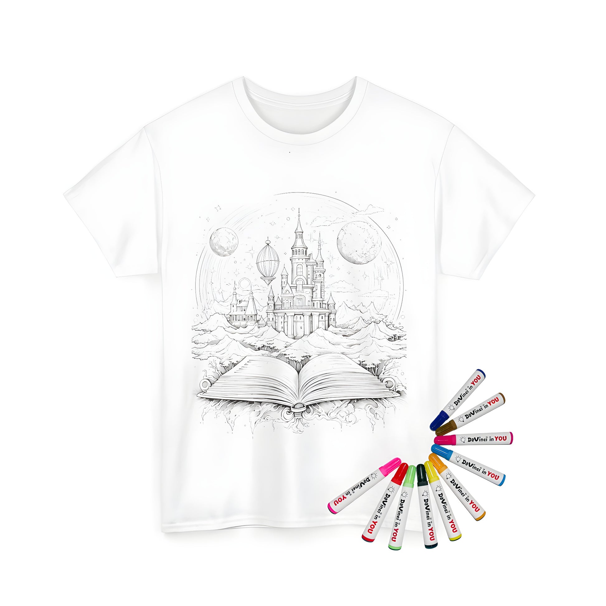 Illustrated storybook coloring page design on a unisex t-shirt featuring an enchanted castle emerging from a book surrounded by mountains and planets with colorful fabric markers