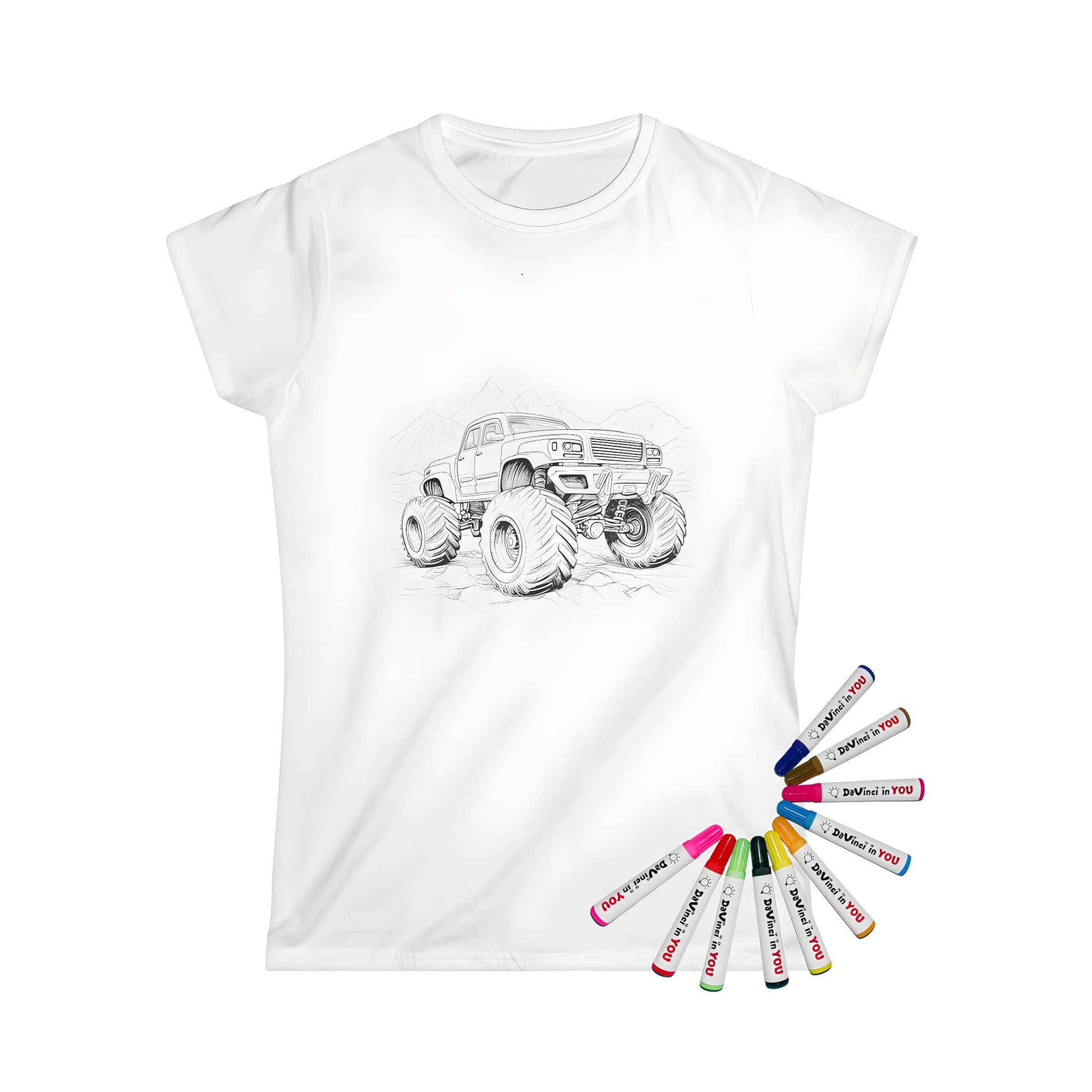 Women's t-shirt featuring a detailed black and white illustration of a monster truck with oversized tires in front of a mountain landscape, perfect for coloring with fabric markers.