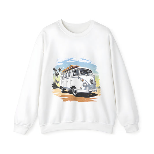 A colorful adult sweatshirt featuring a vintage-style Volkswagen van with surfboards on the roof, parked on a serene beach scene with palm trees and a clear blue sky