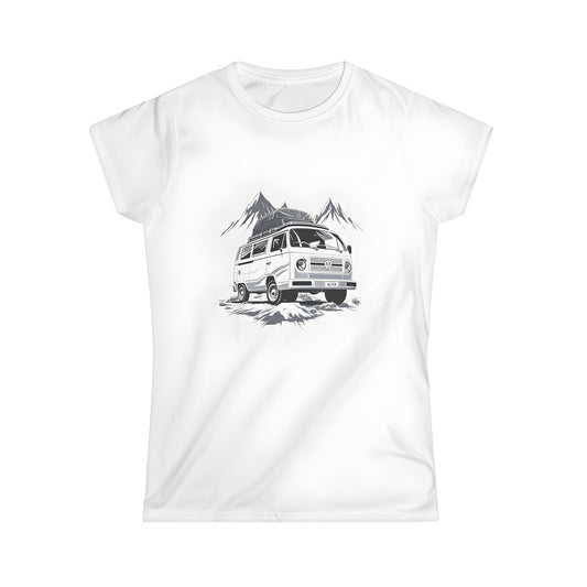 A colorful women's t-shirt featuring an illustration of a motorhome parked on a rugged terrain with mountains in the background, perfect for adventure and travel enthusiasts