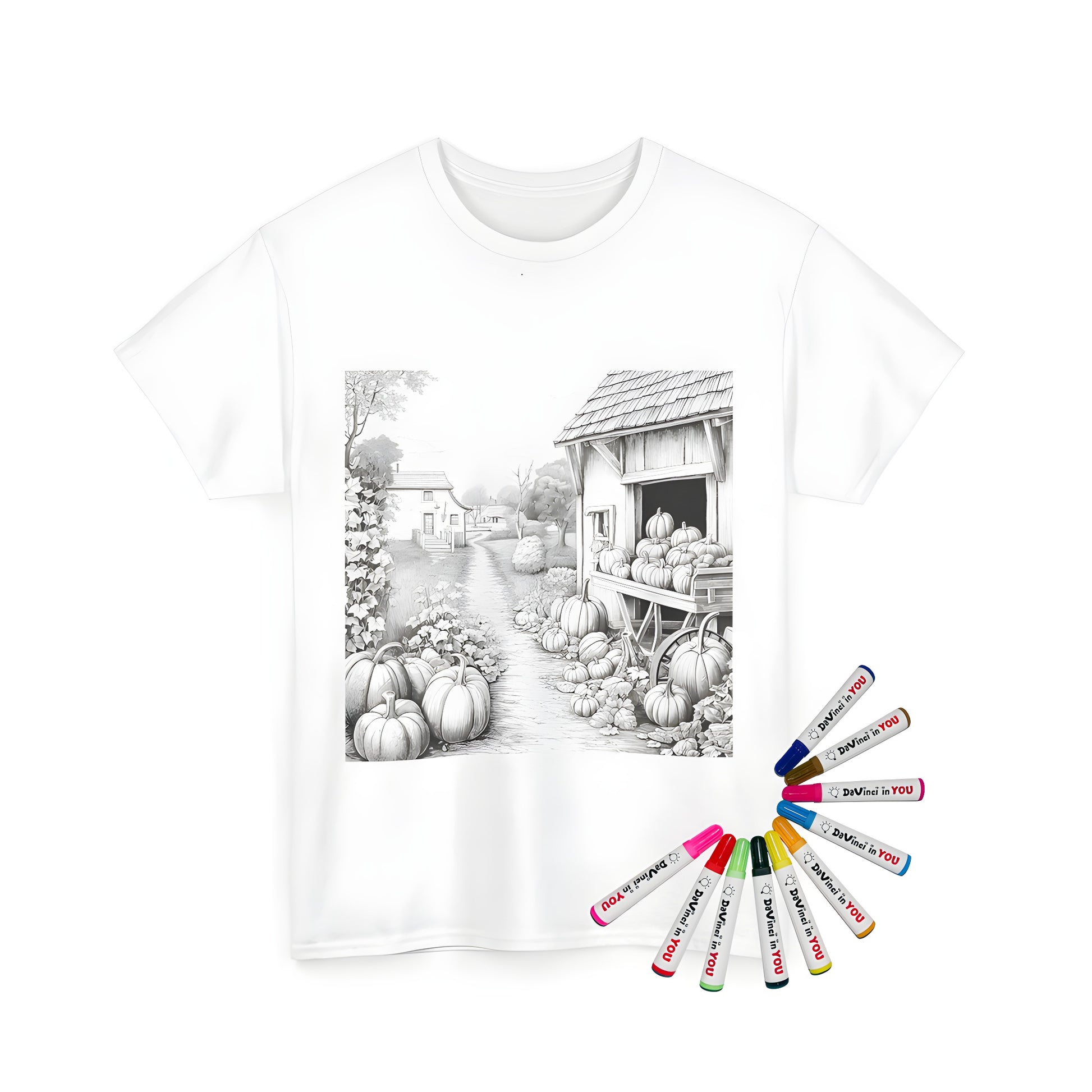 Unisex t-shirt featuring a black and white countryside scene for a child's coloring activity with fabric markers, including houses, pumpkins, trees, and a barn