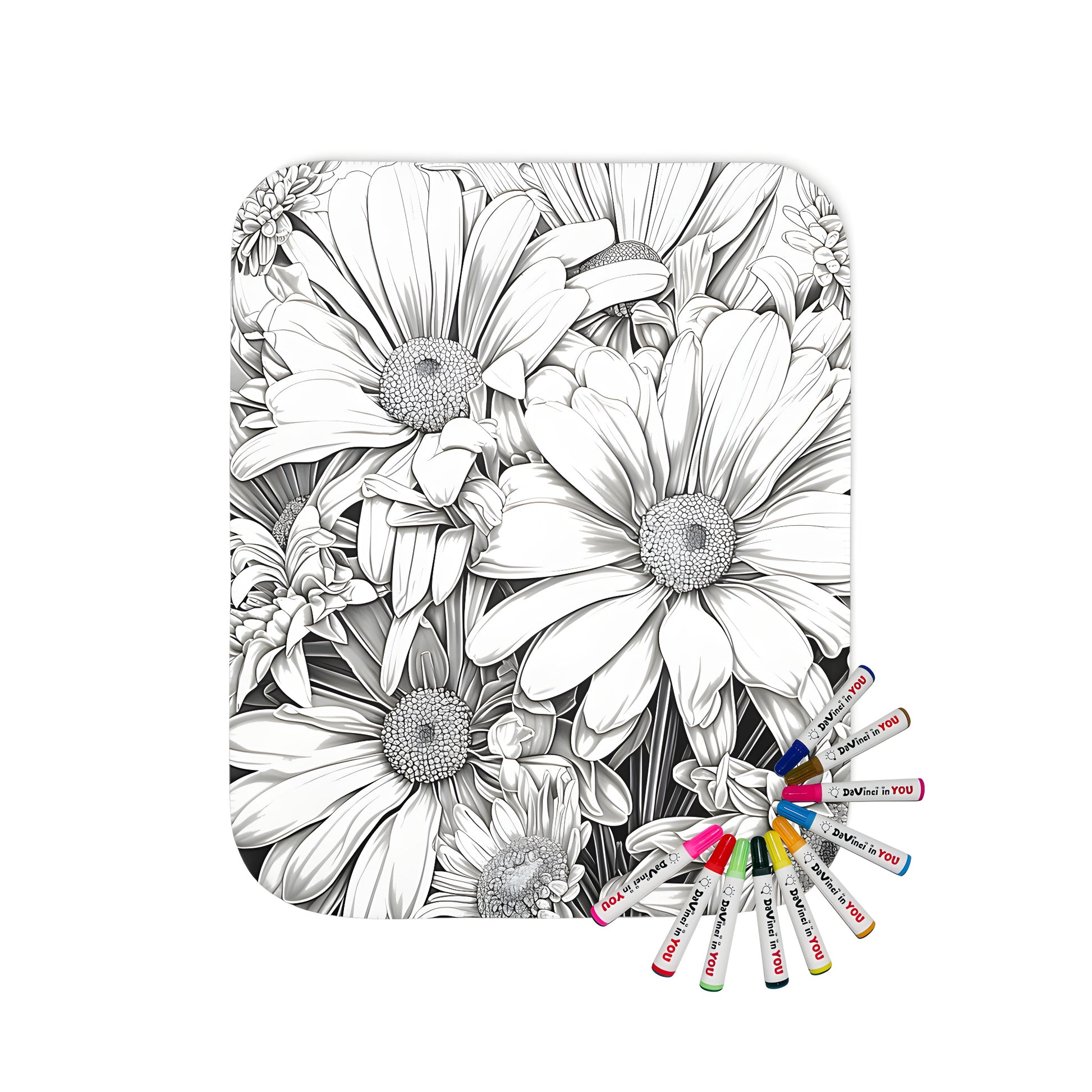 Blanket coloring kit with intricate floral designs of black and white daisies, sunflowers, and other flowers on a soft fabric background