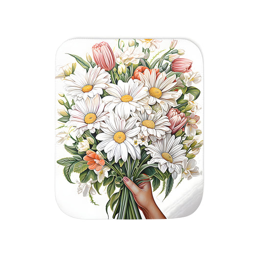 Cozy blanket featuring a colorful floral arrangement of daisies and tulips