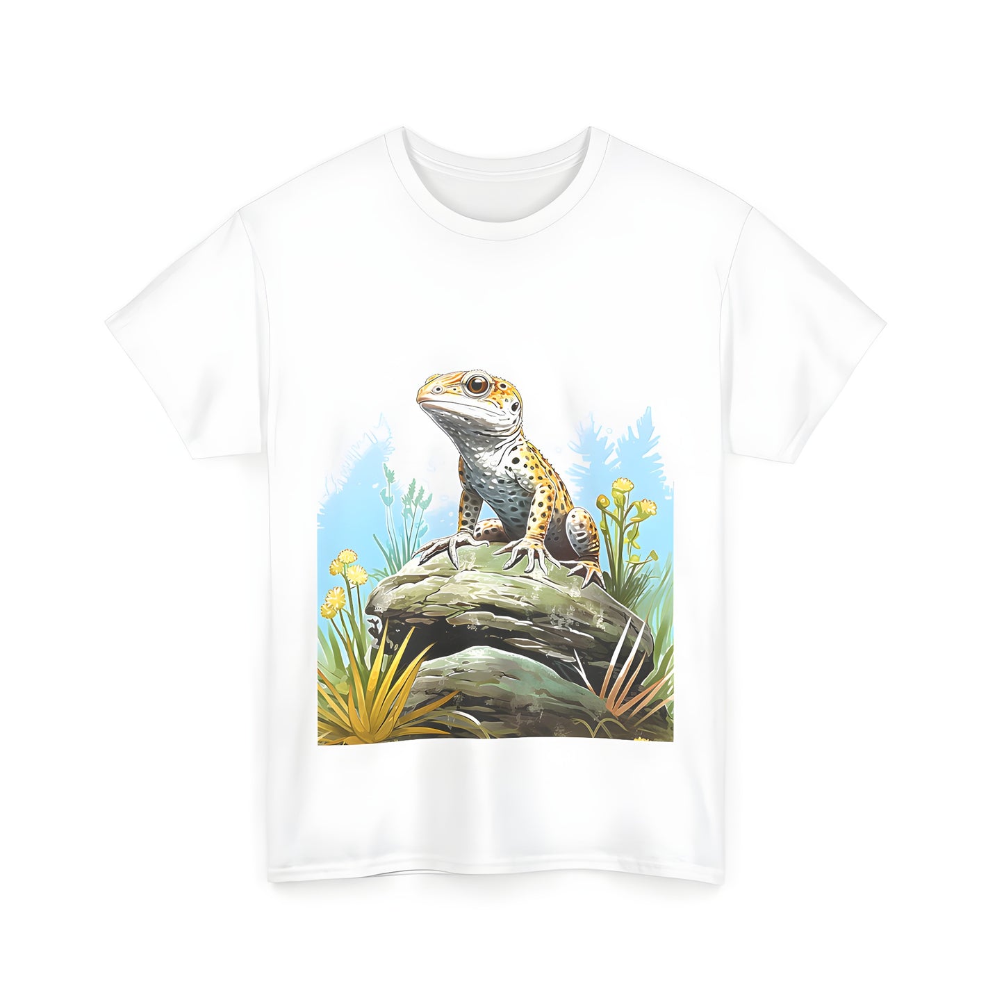 A vibrant gecko perched on a rock amidst yellow flowers and greenery in a natural outdoor setting. Worn with our comfortable unisex tee.