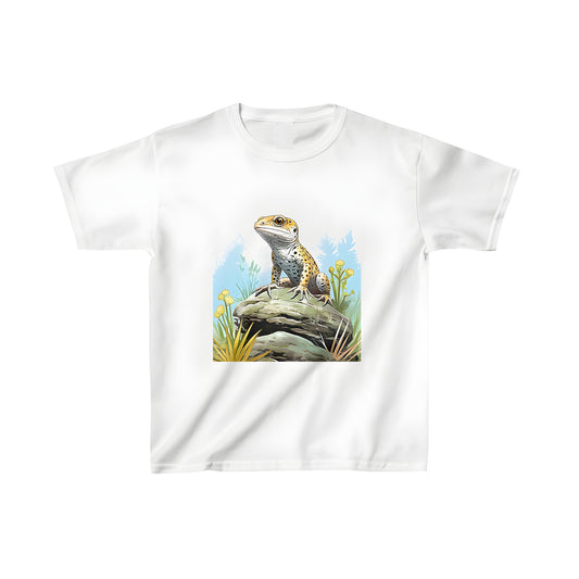 A vibrant lizard (gecko) perched on a rock amidst yellow flowers and greenery in a natural outdoor setting featured on a kid's casual t-shirt.