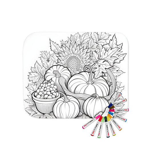 A cozy blanket with a beautiful harvest-themed illustration of pumpkins, grapes, fall leaves, and sunflowers, perfect for snuggling up while coloring.