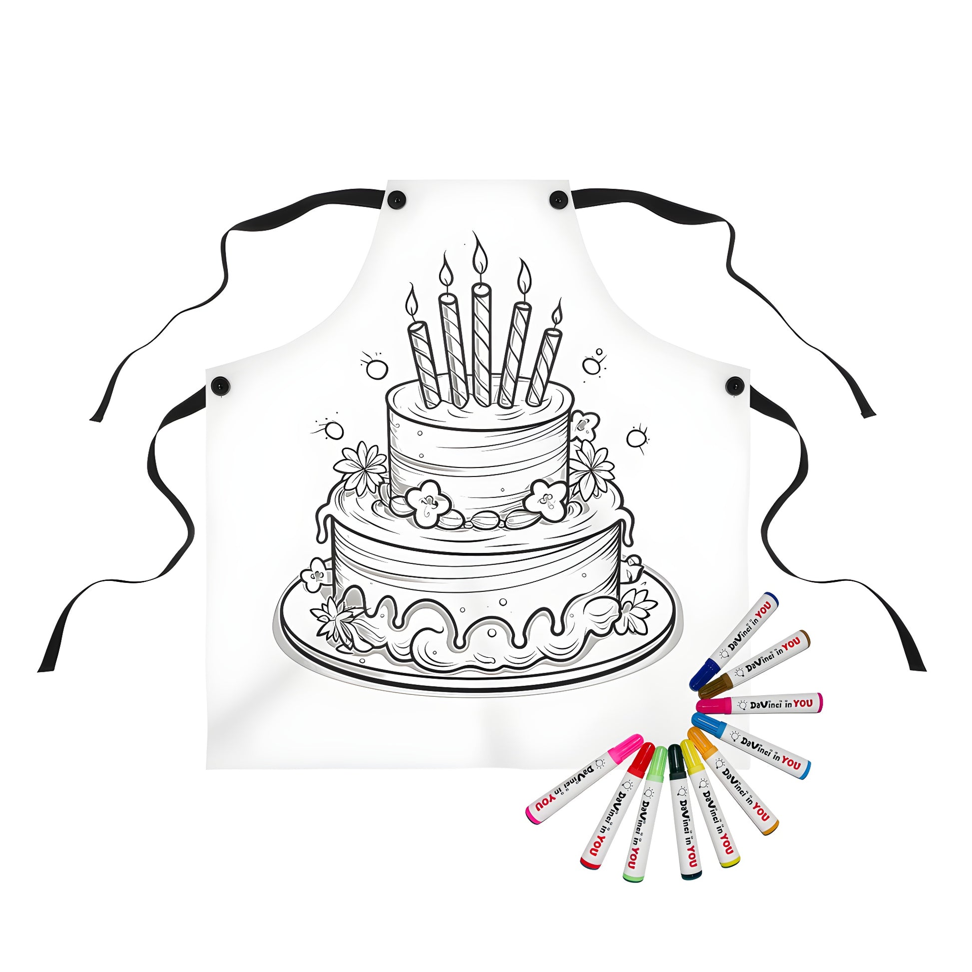 Apron featuring a colorful birthday cake illustration with candles and flowers on a black background