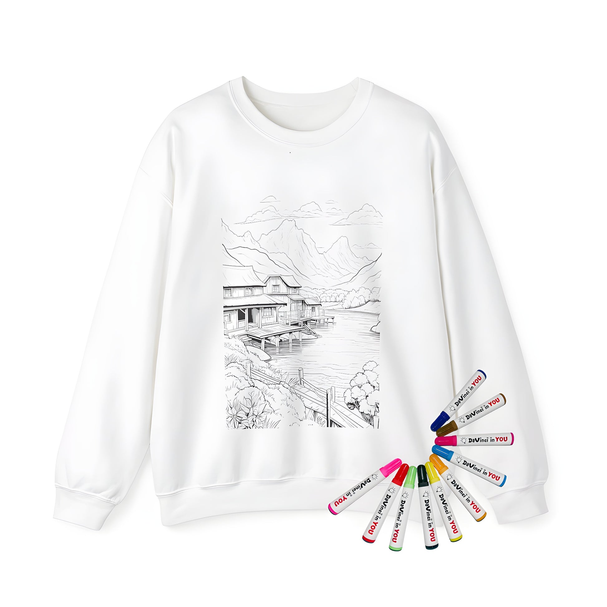 Adult sweatshirt featuring a serene village scene with wooden houses, a calm lake, and majestic mountains in a lush green setting.