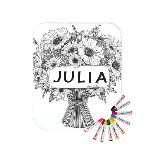 A beautiful blanket featuring a detailed black and white outline of daisies in a bouquet design with the name Julia at its center