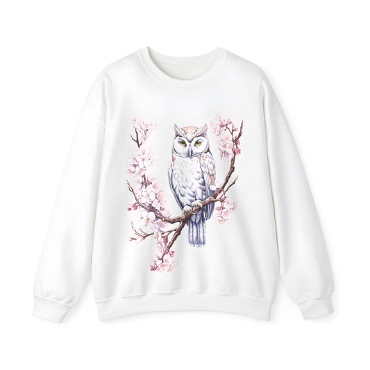 Colorful illustration of an owl perched on a branch with pink blossoms and intricate details on an adult sweatshirt