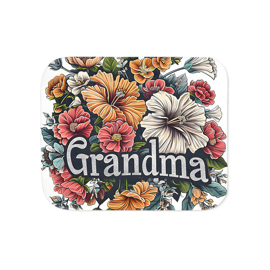 A colorful blanket featuring a detailed floral arrangement of flowers, leaves, and Grandma's loving touch, perfect for snuggling up in comfort.