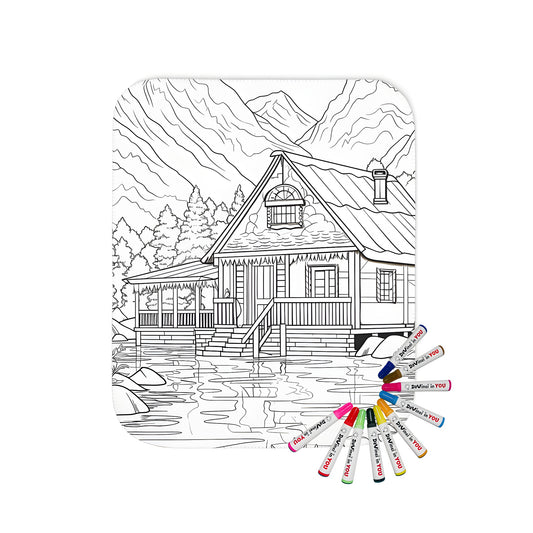 Cozy cabin blanket featuring a detailed coloring page design of a lake scene with trees and mountains