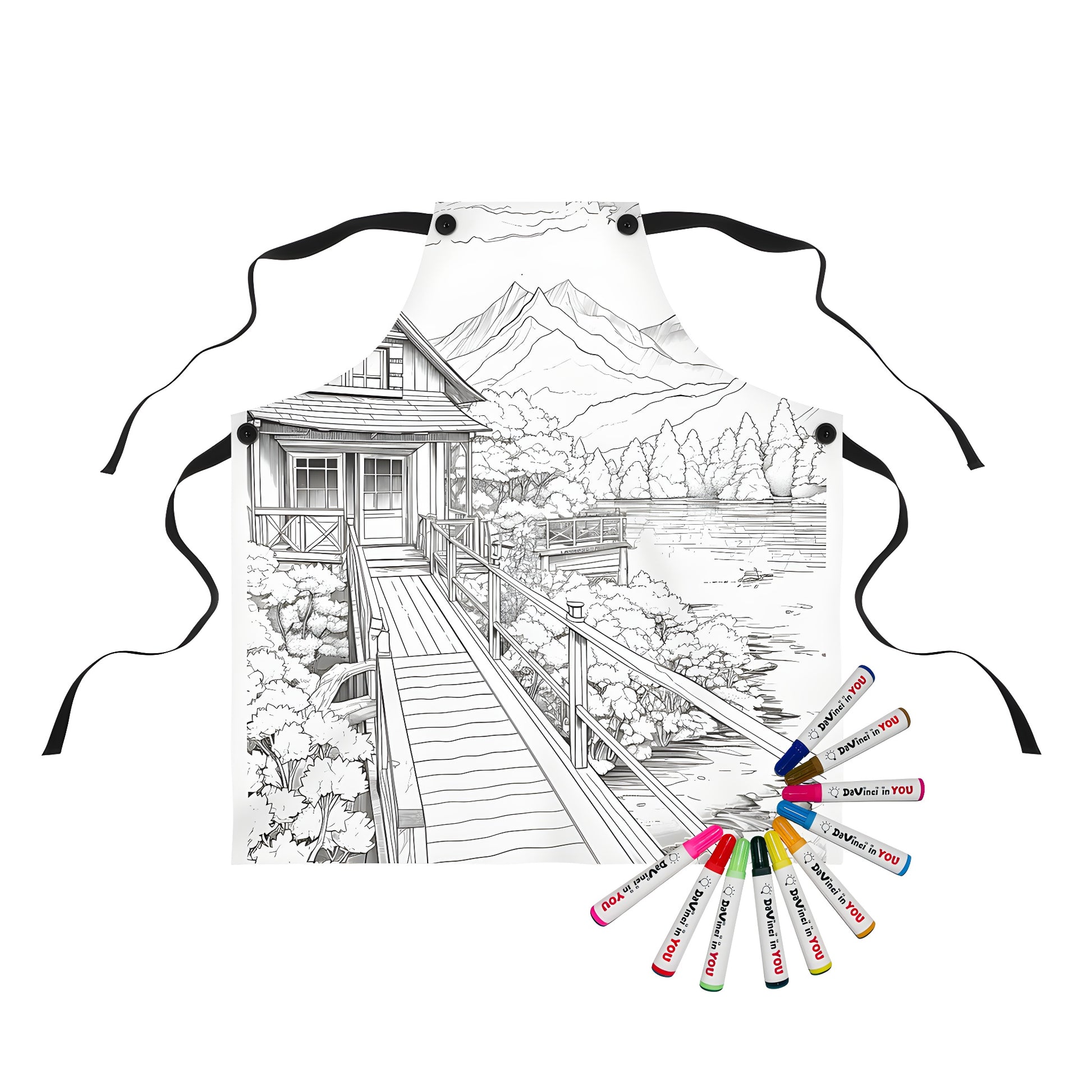 Colorful apron featuring a lakeside cabin scene with wooden bridge, trees, and mountains