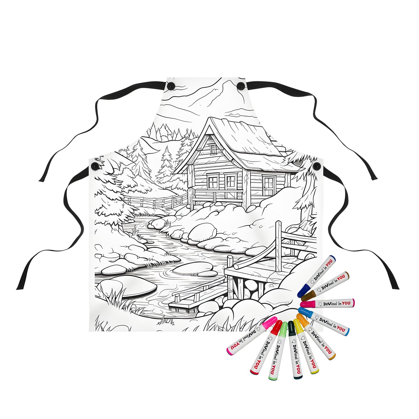 Mountain cabin apron for sale, featuring a detailed illustration of a rustic cabin beside a stream, surrounded by trees and mountains