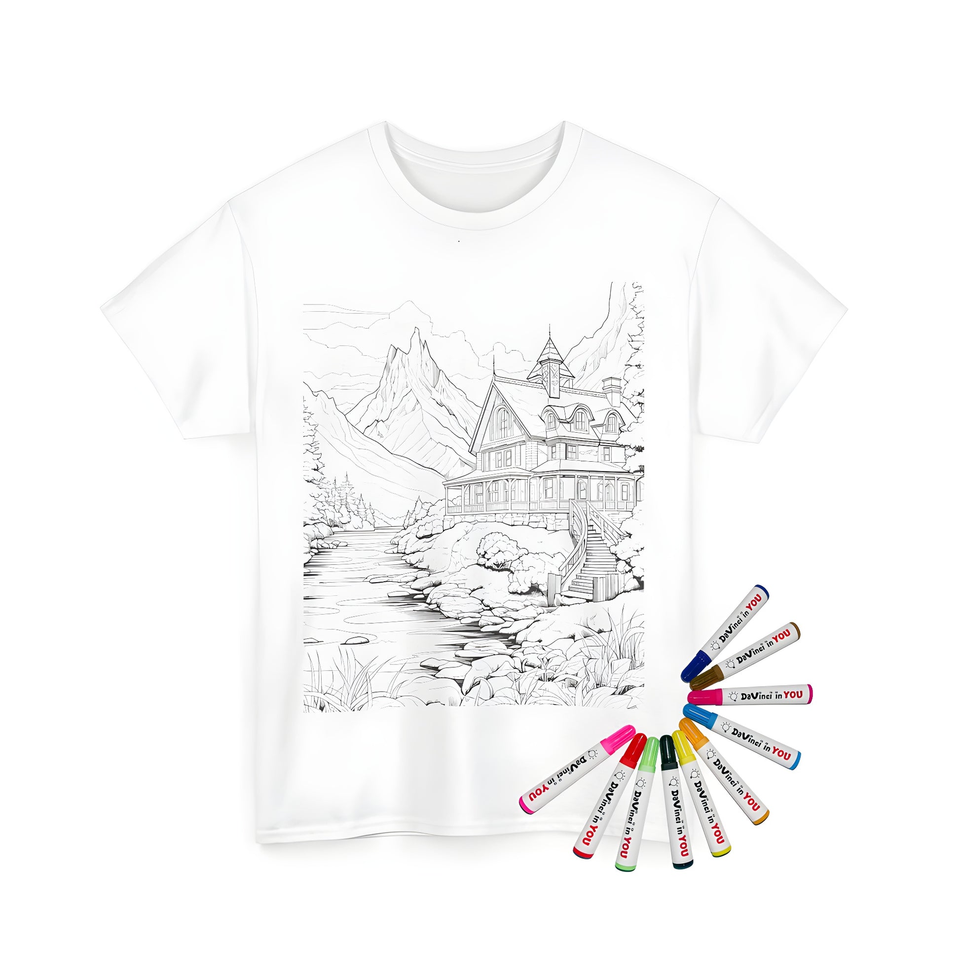 Coloring kit for a unisex t-shirt featuring a detailed illustration of a mountain cabin scene by a river, with majestic mountains and trees in the background.