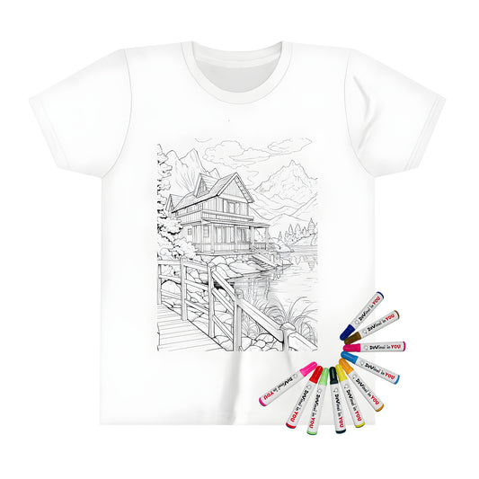 Kid's t-shirt featuring a lakeside cabin design with a wooden bridge, trees, rocks, and mountains. Perfect for kids who love nature, camping, or the great outdoors.