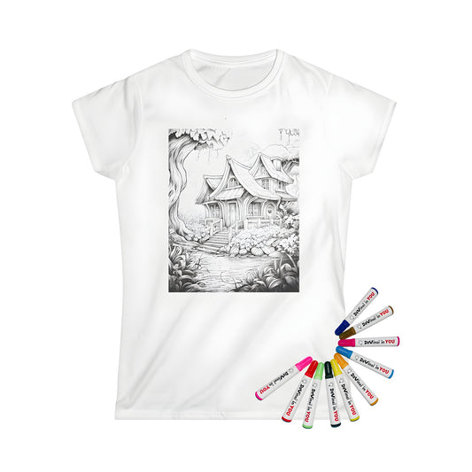 Women's t-shirt featuring an enchanting wooden cottage illustration on a colored background with trees, flowers, and a small stream