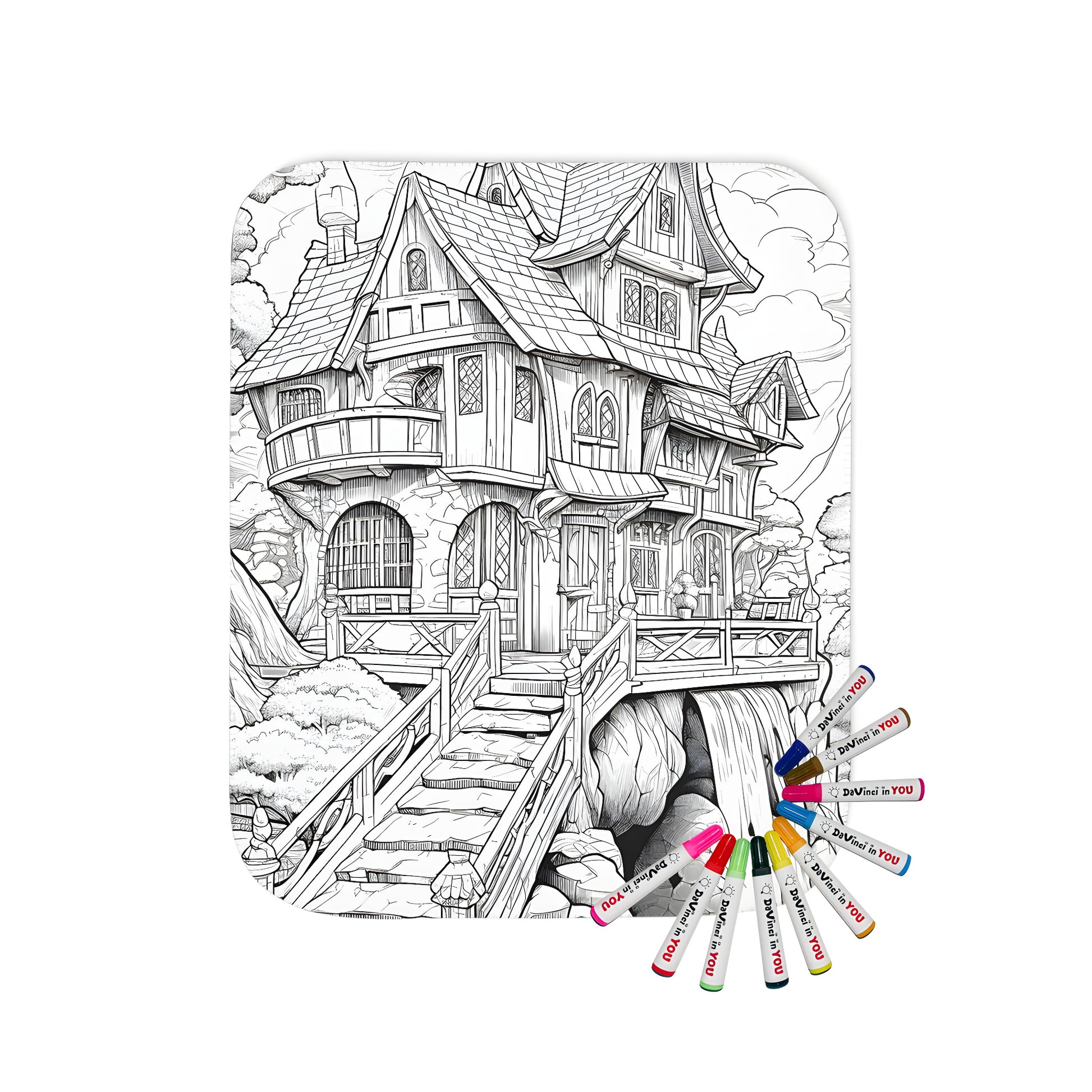 Coloring blanket with whimsical black and white illustration of a fantasy house, including stairs, waterfall, and surrounding trees