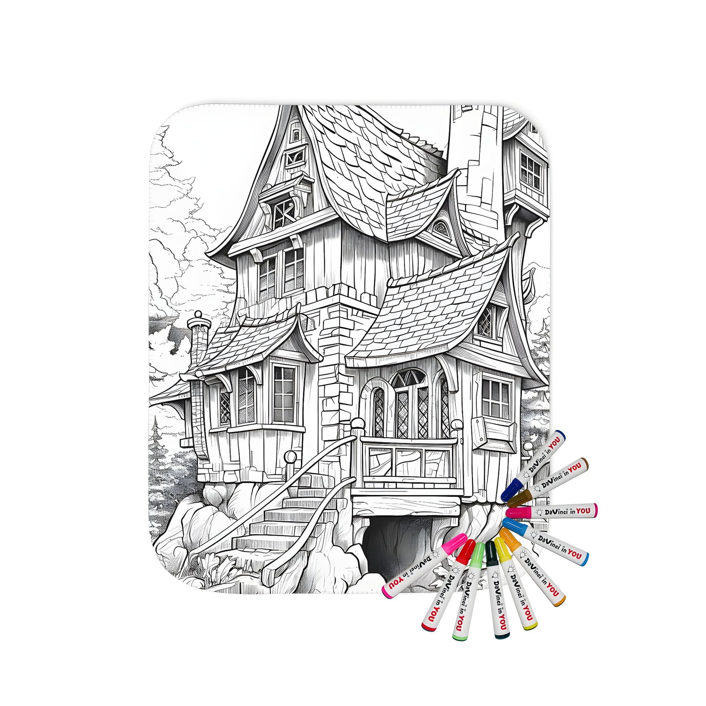 Whimsical black and white blanket featuring a magical fantasy cottage scene with steep roofs, forest trees, and detailed rocks