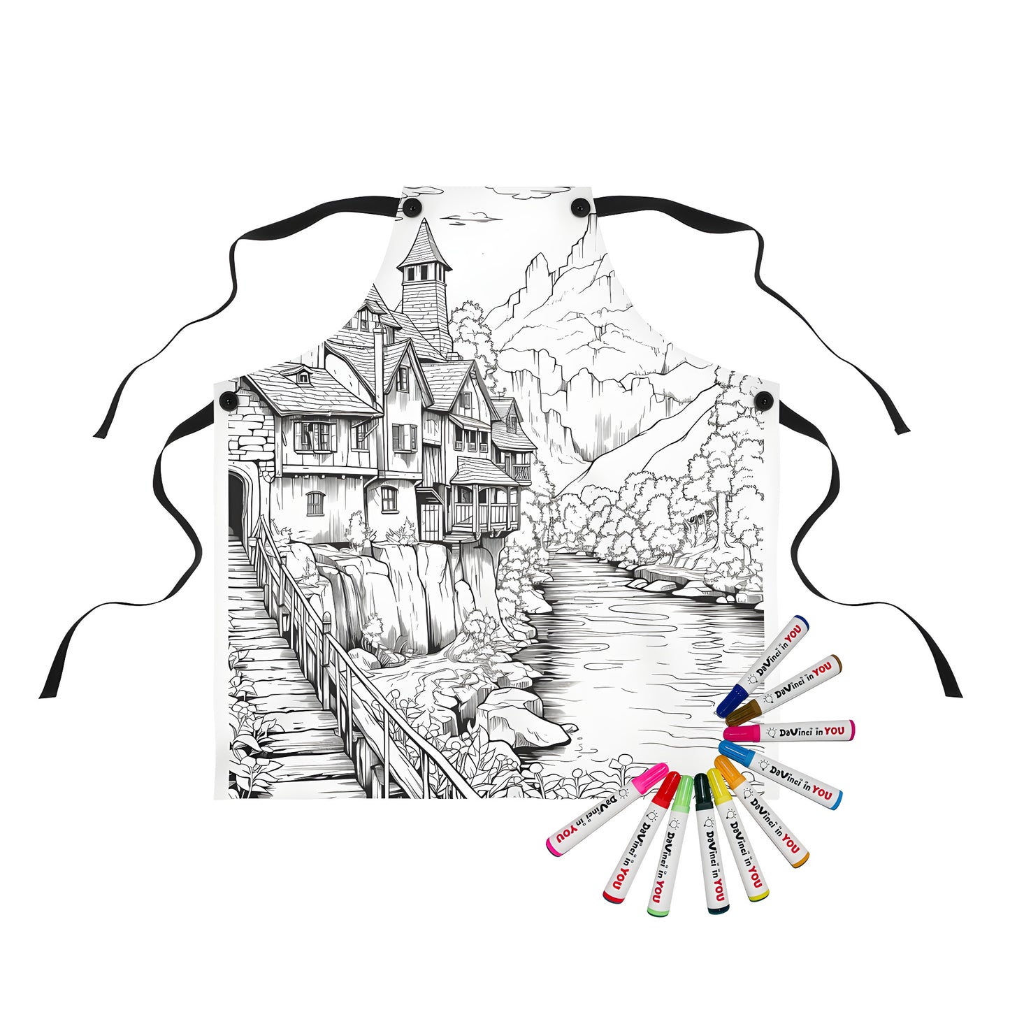 Coloring apron with detailed black and white village scene featuring houses, river, wooden bridge, and mountain backdrop