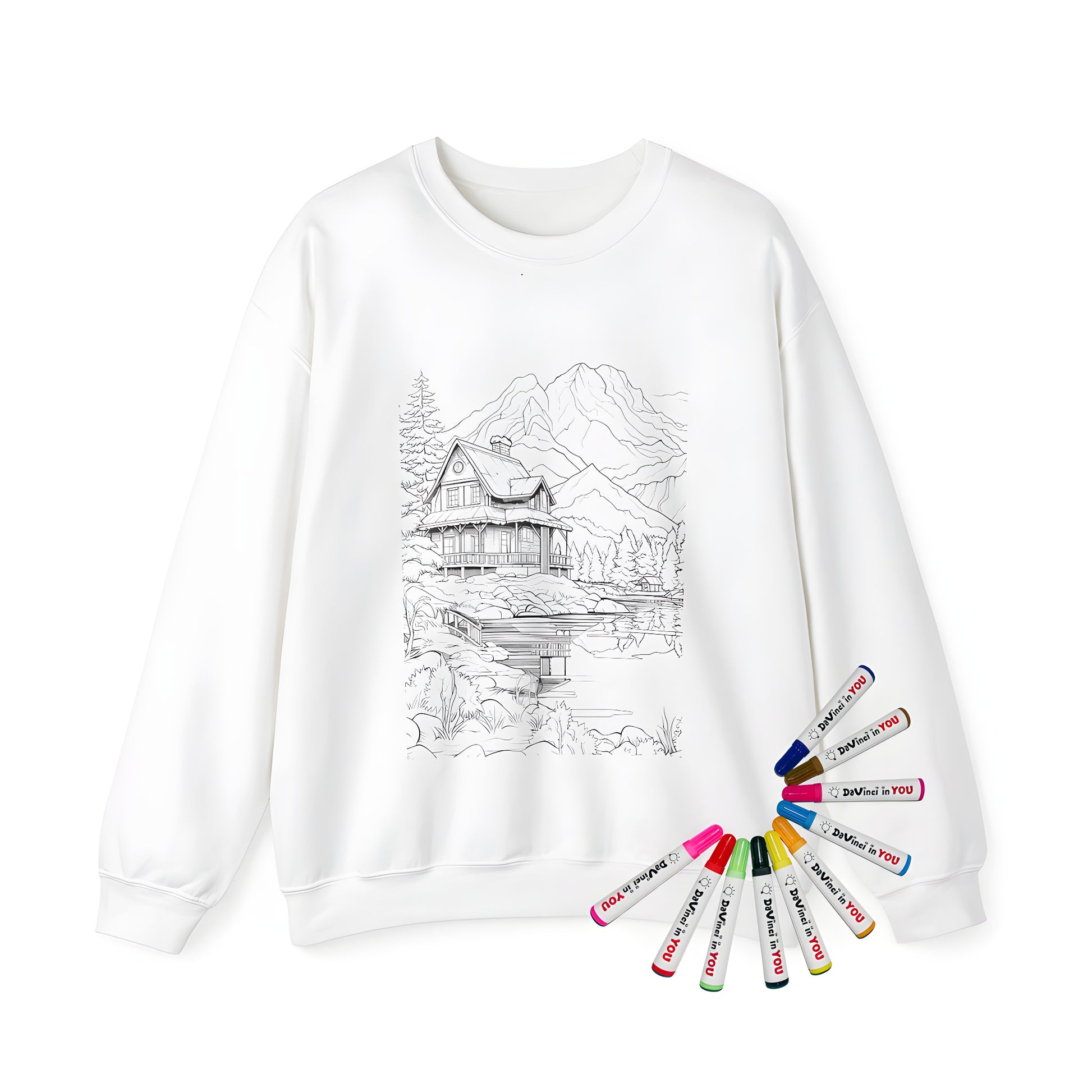 Cozy mountain cabin-themed adult sweatshirt for coloring, featuring a detailed lake scene and trees, with a dock and mountains in the background.