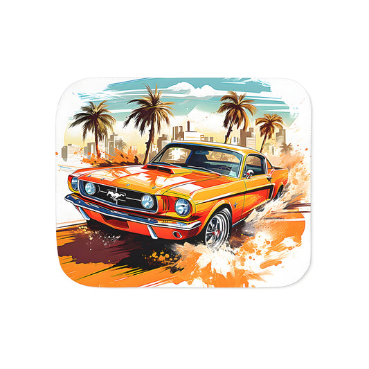 A vibrant blanket featuring a speedy vintage muscle car illustration with palm trees and city buildings