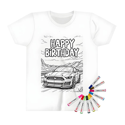 A colorful kid's t-shirt featuring an outlined sports car design on a road with mountains and 'Happy Birthday' text at the top.