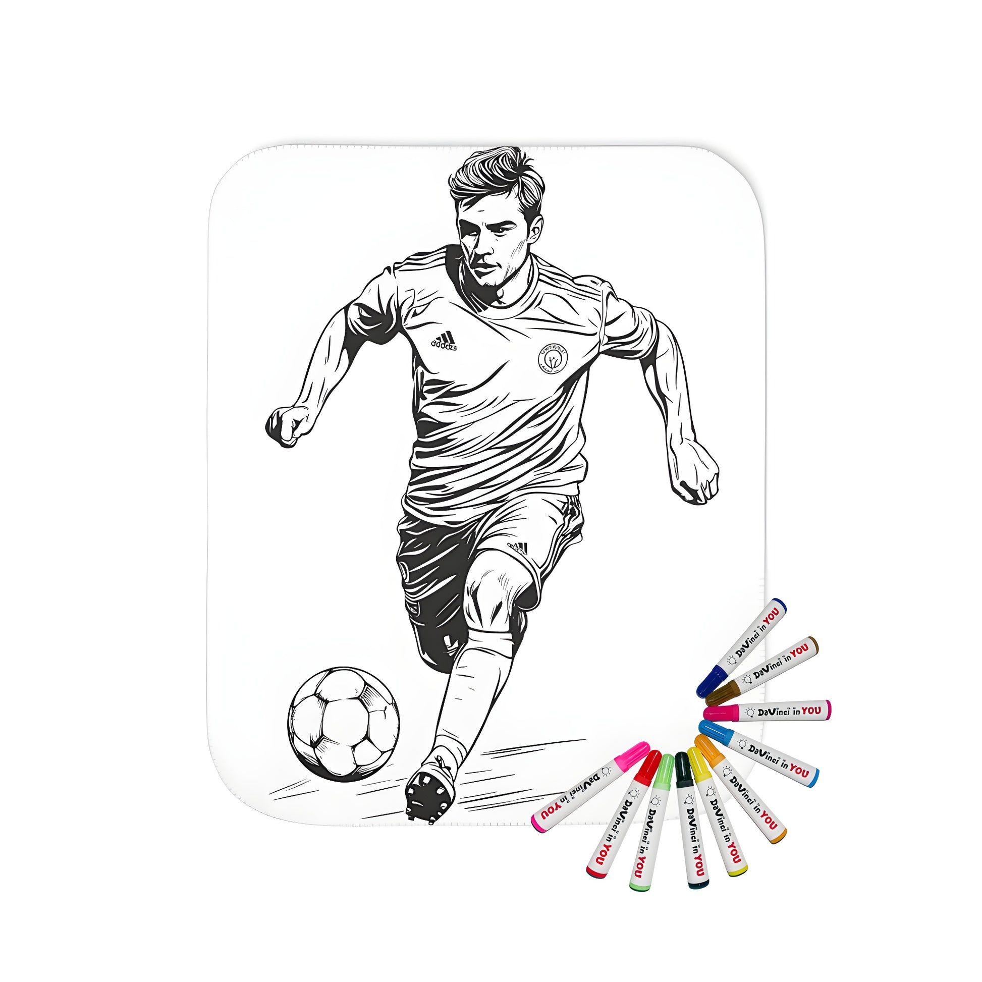 Blanket with a fun black and white soccer-themed design, perfect for sports enthusiasts. Includes vibrant fabric markers for a creative touch.