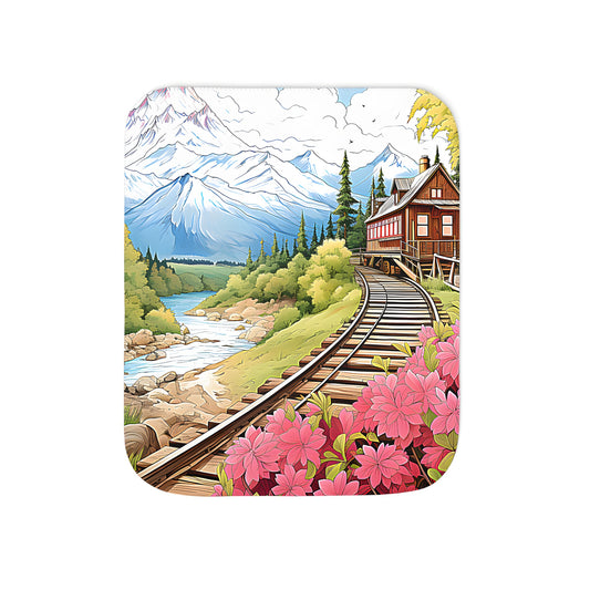 Cozy blanket featuring a serene landscape with railroad tracks, cabin, flowers, pine trees, and river