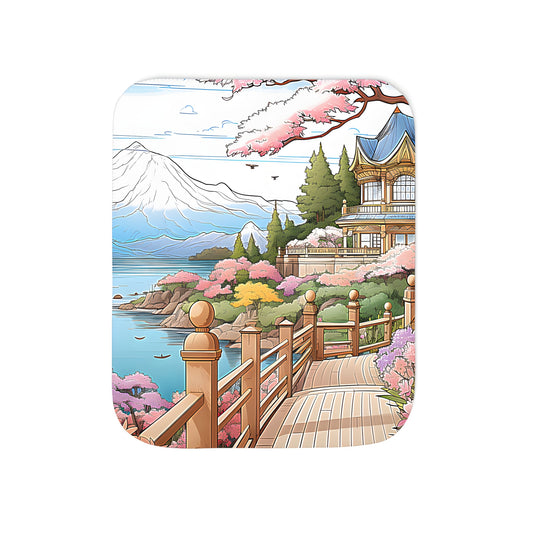 A serene blanket featuring a stunning cherry blossom garden design with a wooden bridge, vibrant flowers, and a tranquil mountain backdrop.