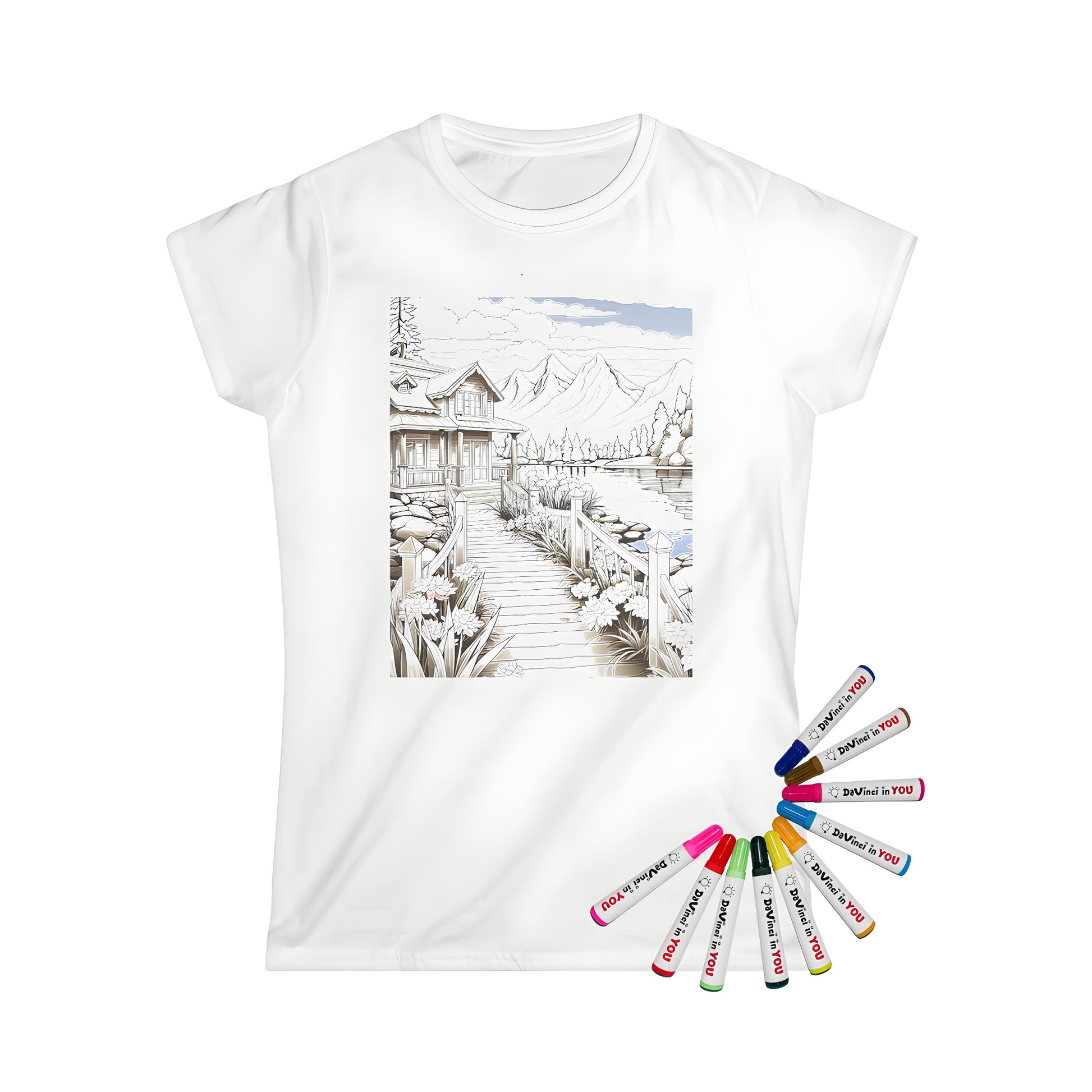 Women's t-shirt featuring a serene mountain landscape, detailed cabin, colorful flowers, and majestic mountains, perfect for adult coloring enthusiasts