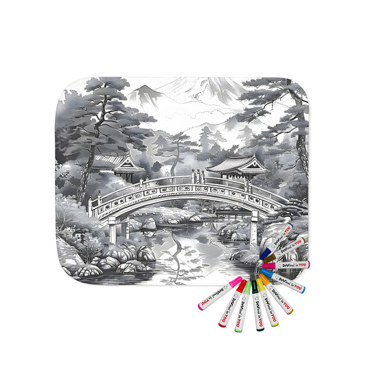 Cozy blanket featuring a Japanese garden design with a scenic bridge over a serene pond, surrounded by snow-capped mountains and lush trees.