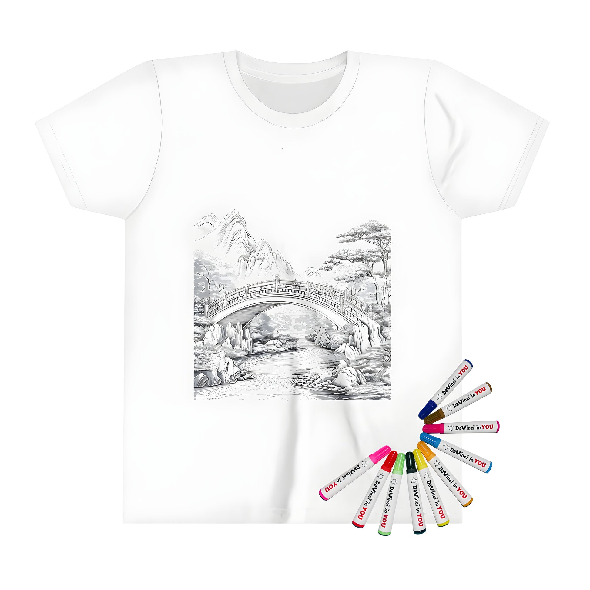 Scenic mountain landscape kids' t-shirt with coloring page design featuring bridge over river and trees