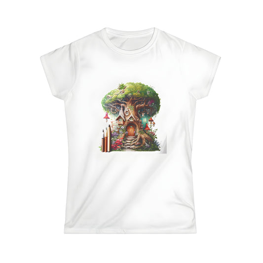 Women's colorful t-shirt featuring beautifully detailed whimsical treehouse illustration with flowers, mushrooms, and artistic brushstrokes