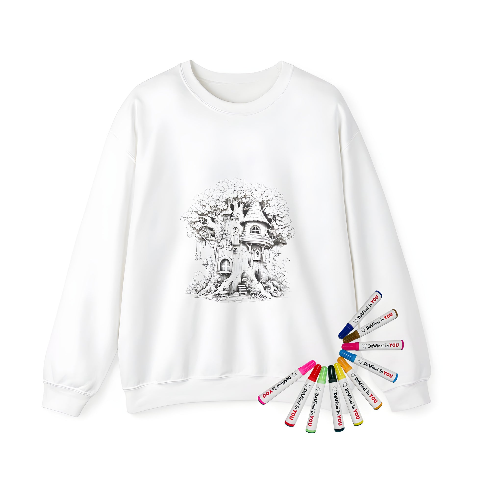 Adult sweatshirt featuring colorful fairy treehouse illustrations, whimsical door and window details, and intricate tree branches. Includes fabric markers for creative coloring