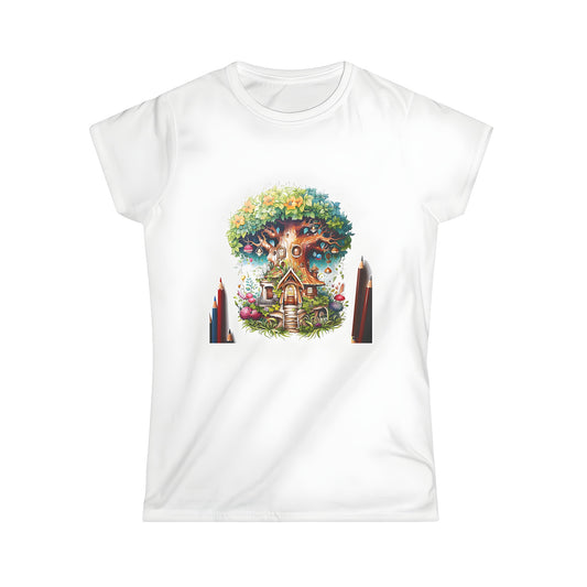 Women's colorful t-shirt featuring a whimsical fantasy treehouse illustration with flowers and mushrooms surrounded by colored pencils