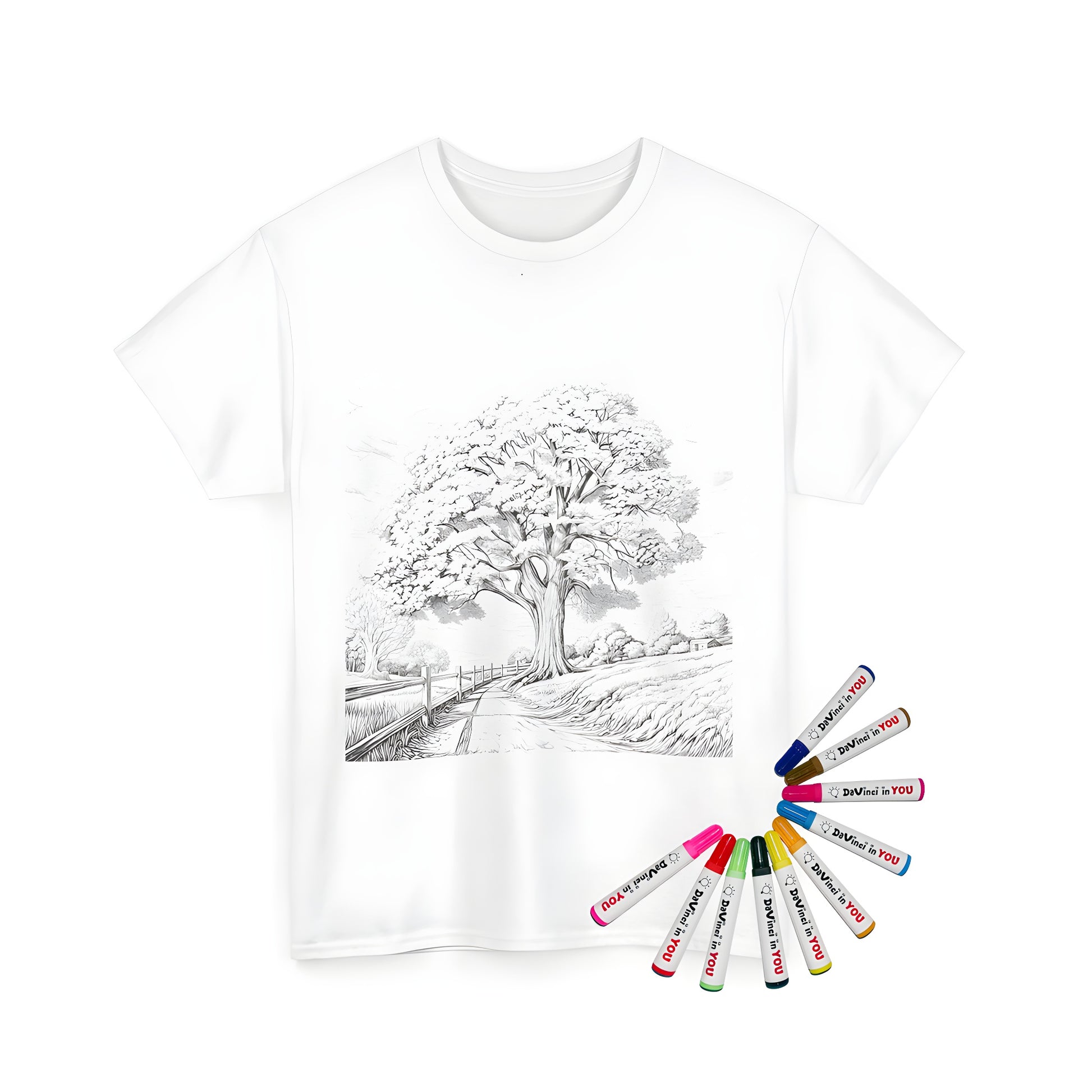 A unisex t-shirt featuring an illustration of a tree in a countryside landscape design, surrounded by fields and a wooden fence, perfect for a coloring kit with fabric markers