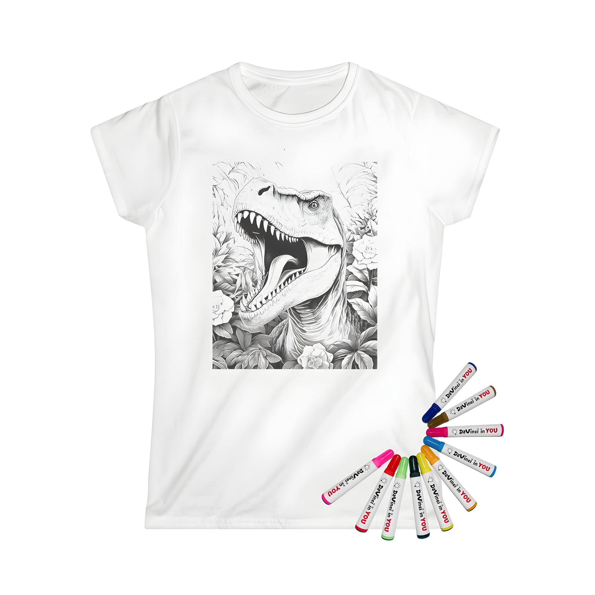 Coloring kit on women's t-shirt featuring a detailed illustration of a roaring tyrannosaurus rex amidst jungle plants and flowers, with fabric markers for creative expression.