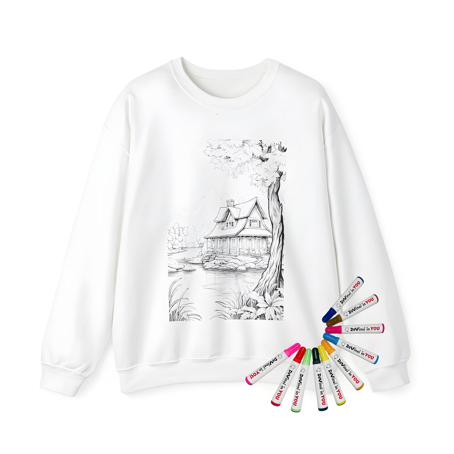 Adult Sweatshirt featuring a serene lake scene with a cozy cabin and trees framed against a mountainous background