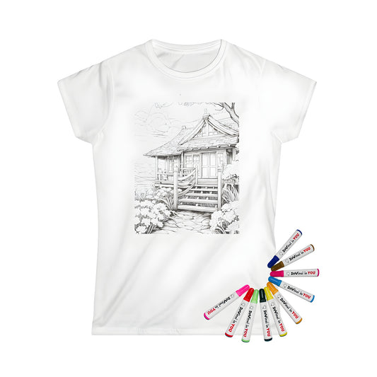 Women's t-shirt featuring a colorful illustration of a quaint cottage scene with garden, pathway, and staircase. Black and white design with vibrant fabric markers