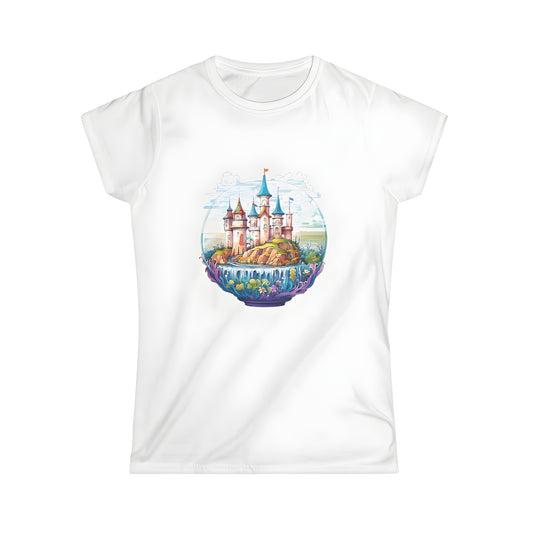 Women's fantasy castle graphic t-shirt featuring a colorful illustration of a mystical fortress on a rocky island surrounded by water and lush greenery.