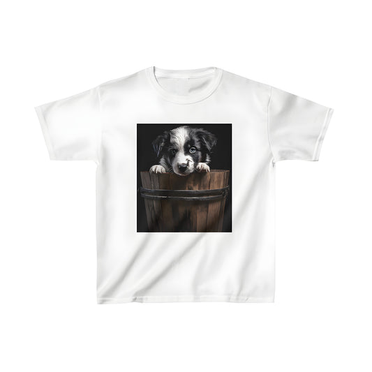 Kids graphic t-shirt featuring a cute black and white dog peeking out of a wooden bucket