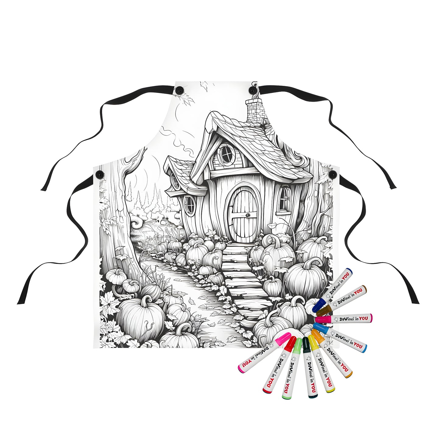 Apron with enchanting countryside scene printed on it, features a fantasy cottage illustration surrounded by pumpkins and trees