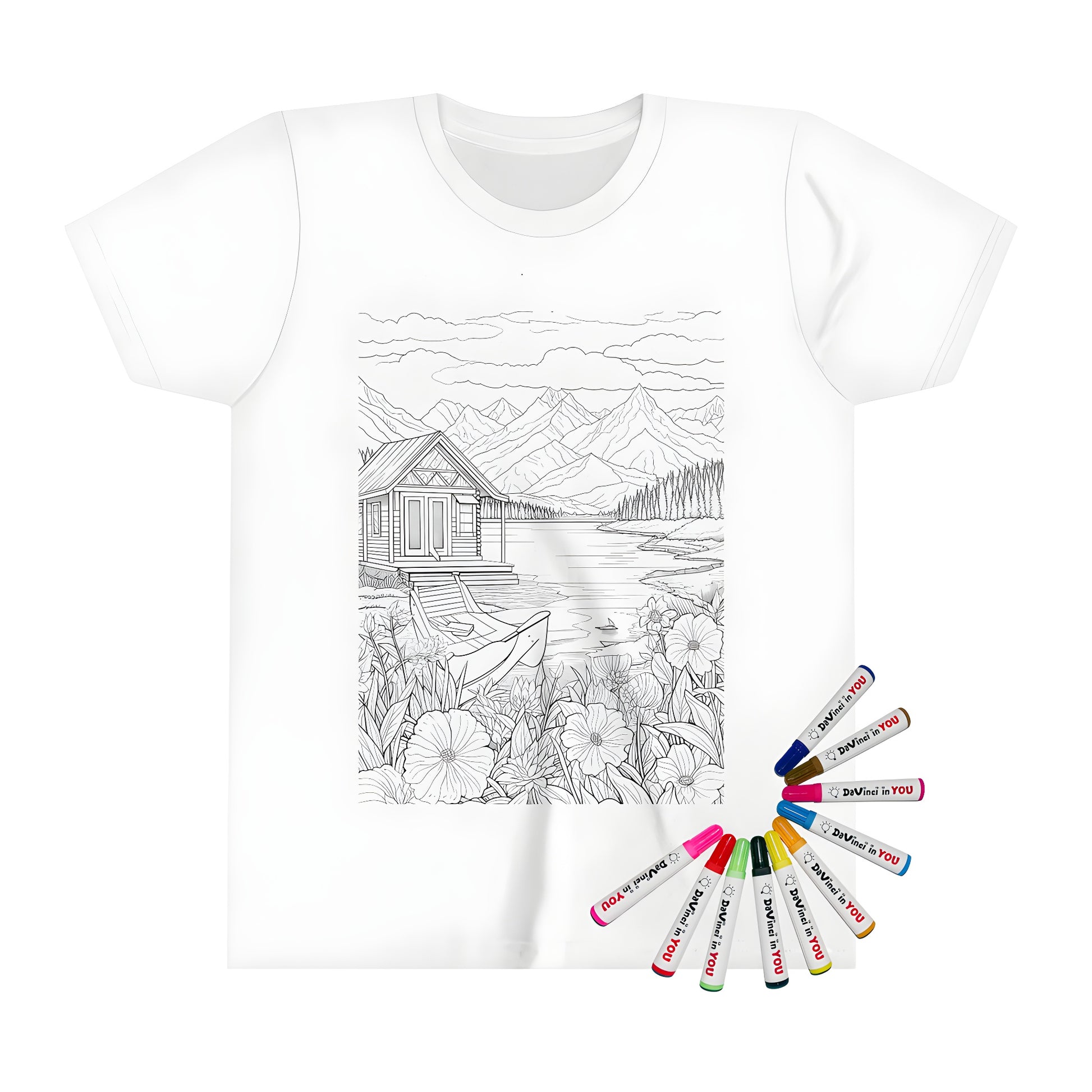 Mountain retreat-themed kid's t-shirt with vibrant coloring page design featuring cabin on lake, surrounding flowers, and distant mountains. Includes 10 fabric markers for creative expression.