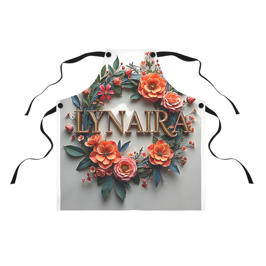 A stylish apron with a floral wreath design featuring vibrant flowers and green leaves surrounding the name 'Lynaira' in bold gold letters