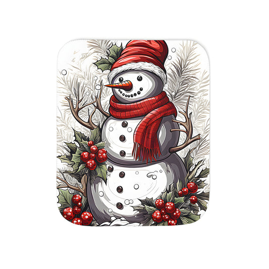 Colorful winter blanket featuring a festive snow figure, fun holiday design with red hat, scarf, antlers, and holly leaves with red berries, set against a snowy background.