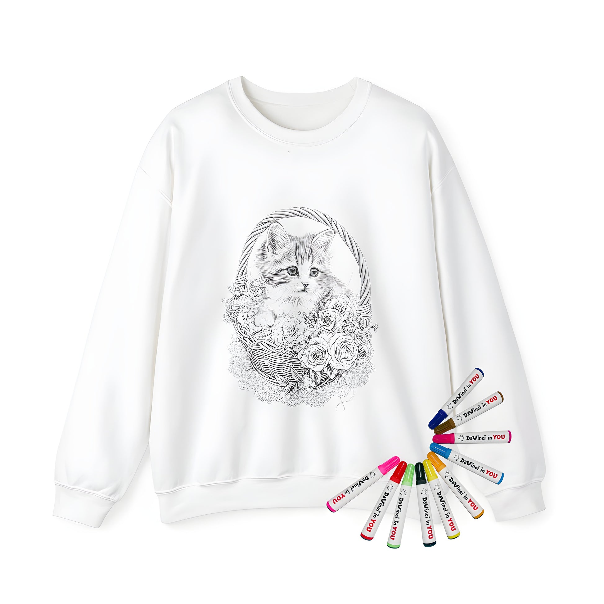 Fluffy kitten sitting in a woven basket with blooming roses and lace details on an adult sweatshirt