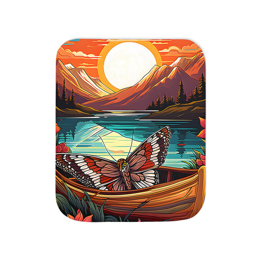 Cozy blanket with vibrant Mountain Sunset inspired design featuring a butterfly on a canoe amidst colorful flowers and serene lake surroundings